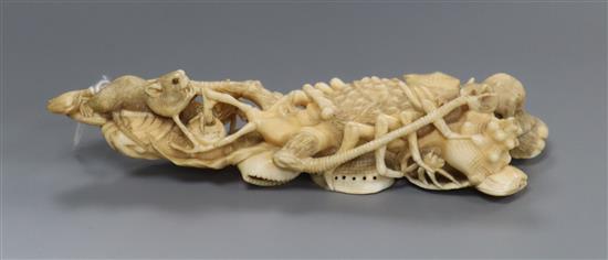 A Japanese ivory okimono of rats crawling over a lobster, early 20th century, unsigned 14.5cm